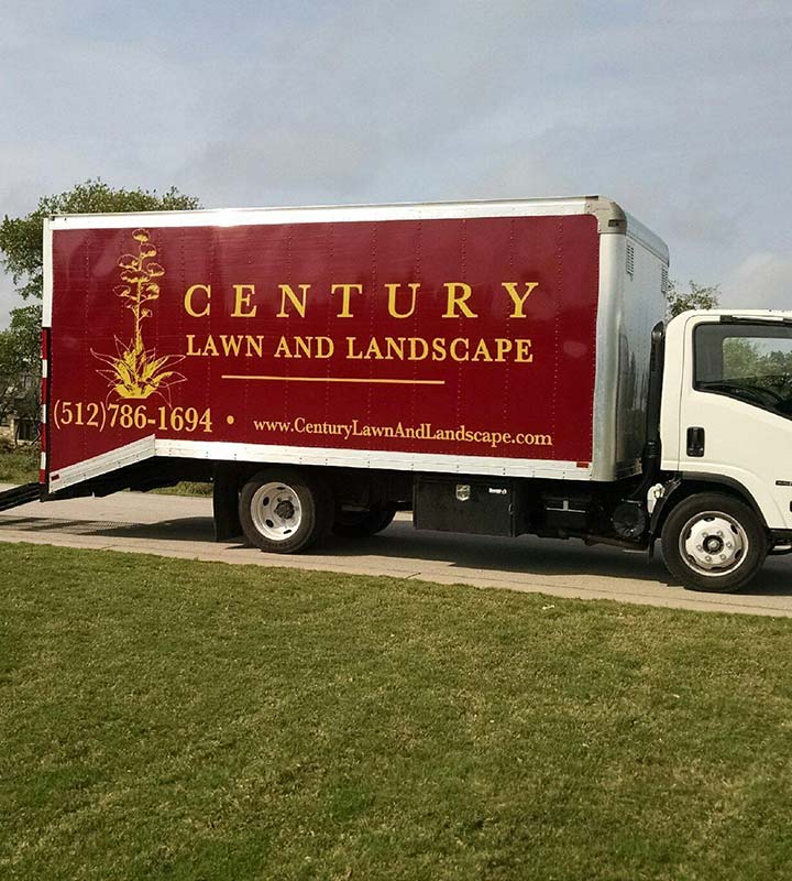 Century Lawn and Landscape box truck at a home in Austin, TX.