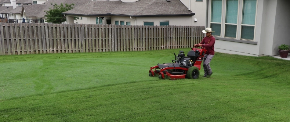 Century professional mowing client's lawn in West Lake Hills, TX.